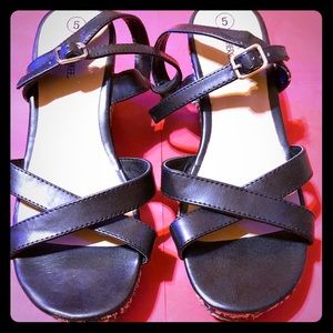 Black and beige woven wedges.